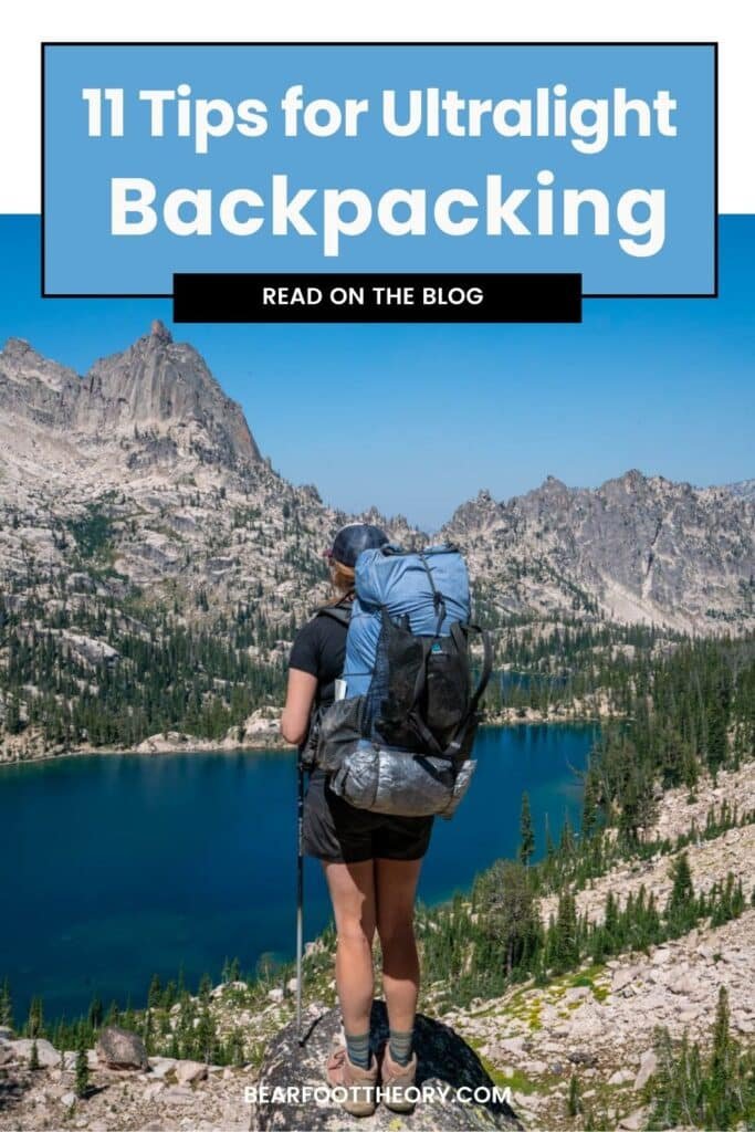 Alaina Hermiston with a backpacking pack in looking out over Baron Lakes in Idaho's Sawtooth Mountains. Text reads 11 Tips for Ultralight Backpacking